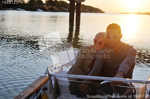 Image of couple in love  have romantic time on boat