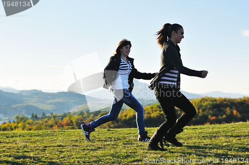 Image of group of teens have fun outdoor