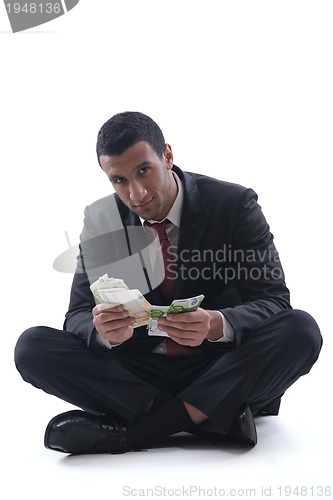 Image of Business man holding money