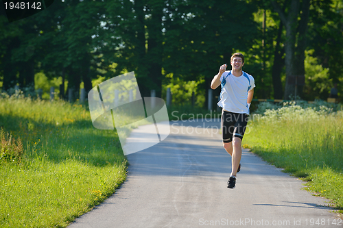 Image of Young beautiful  woman jogging