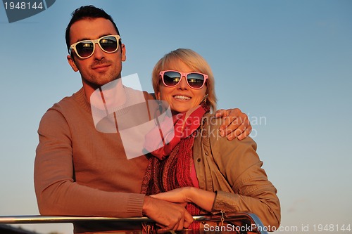 Image of couple in love  have romantic time on boat