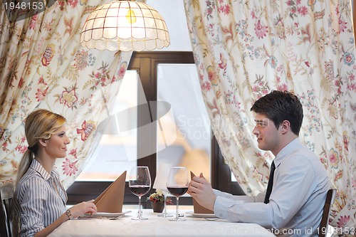 Image of young couple having dinner at a restaurant