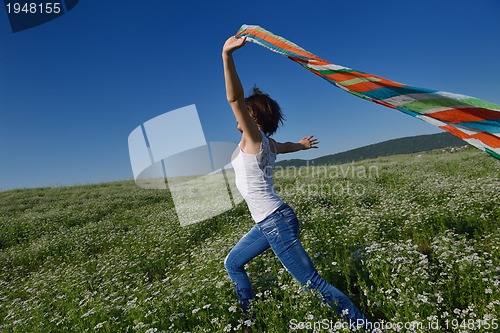 Image of young woman in wheat field at summer