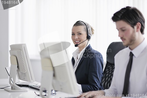 Image of business people group working in customer and help desk office