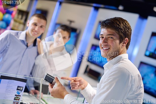 Image of people buy  in consumer electronics store