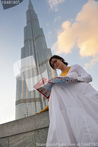 Image of happy tourist woman