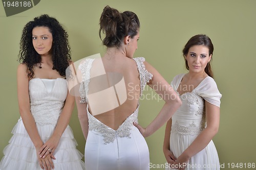 Image of portrait of a three beautiful woman in wedding dress