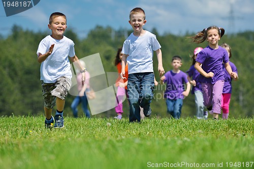Image of happy kids group  have fun in nature