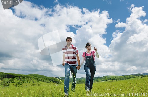 Image of romantic young couple in love together outdoor