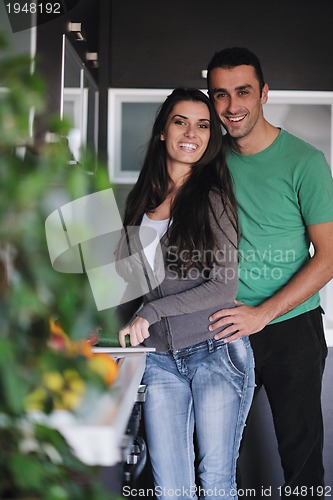 Image of young couple have fun in modern kitchen