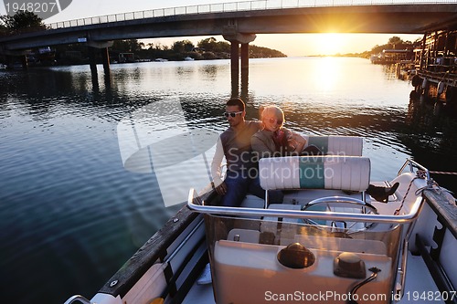 Image of couple in love  have romantic time on boat