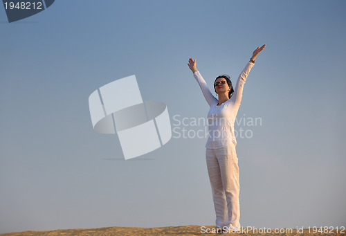 Image of woman relax in desert