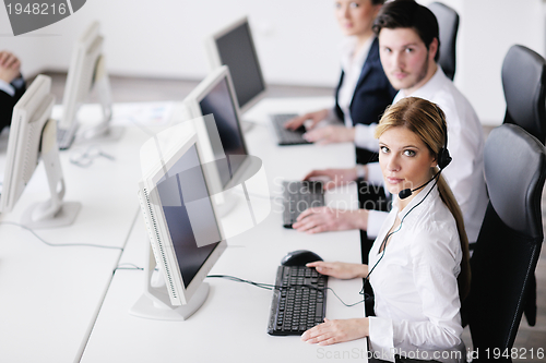 Image of business people group working in customer and help desk office