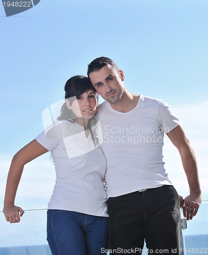 Image of couple relaxing on balcony