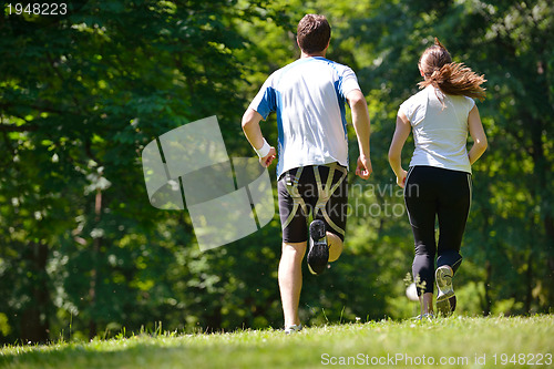 Image of Young couple jogging