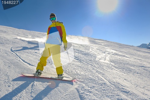 Image of skiing on fresh snow at winter season at beautiful sunny day