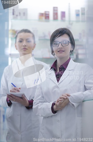 Image of team of pharmacist chemist woman  in pharmacy drugstore