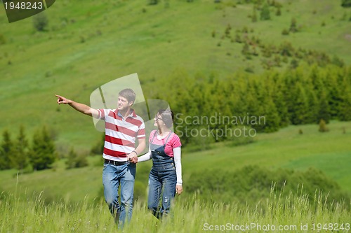 Image of romantic young couple in love together outdoor
