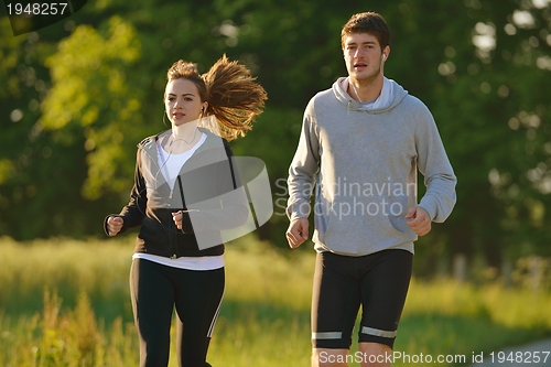 Image of Young couple jogging