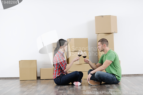 Image of Young couple moving in new house