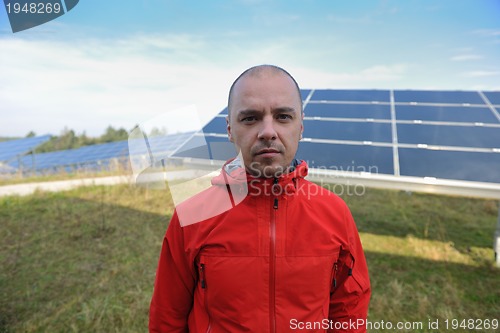 Image of Male solar panel engineer at work place