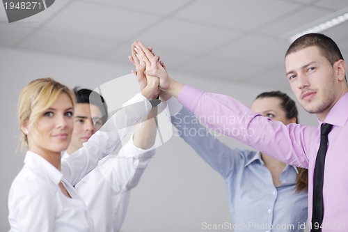 Image of business people group joining hands
