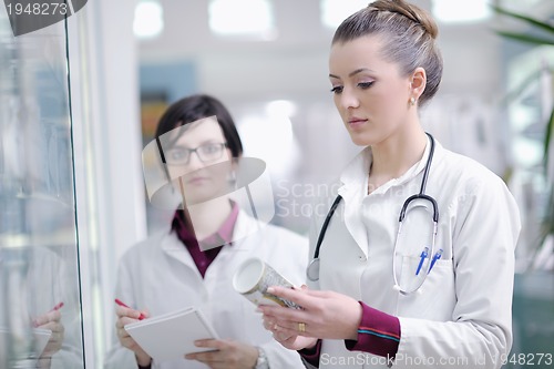 Image of team of pharmacist chemist woman  in pharmacy drugstore