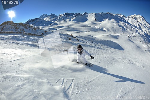 Image of skiing on fresh snow at winter season at beautiful sunny day