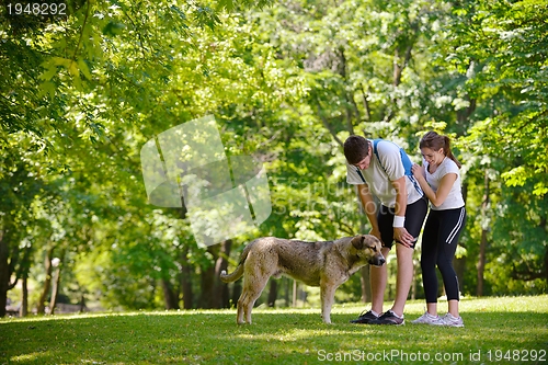 Image of Couple doing stretching exercise  after jogging