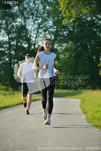 Image of Young couple jogging