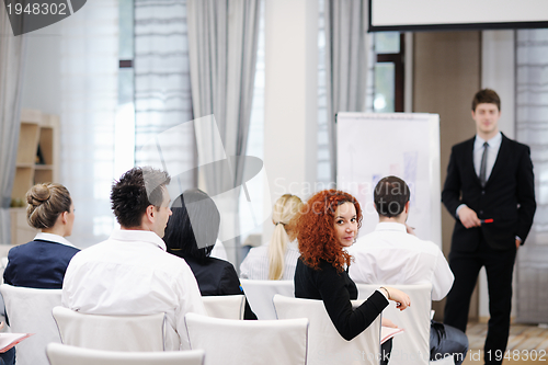 Image of Young  business man giving a presentation on conference