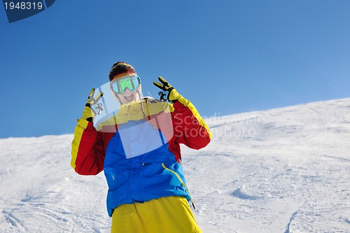 Image of skiing on fresh snow at winter season at beautiful sunny day