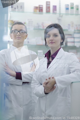Image of team of pharmacist chemist woman  in pharmacy drugstore