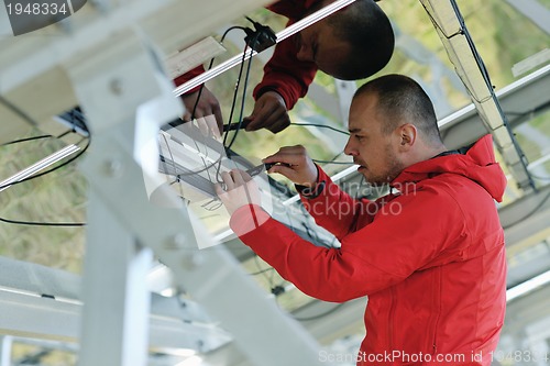 Image of Male solar panel engineer at work place