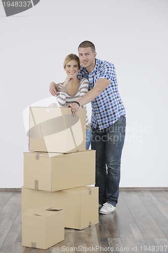 Image of Young couple moving in new home