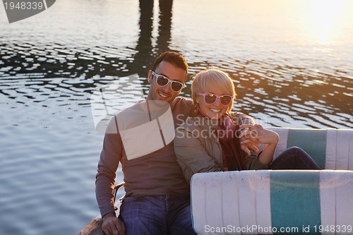 Image of couple in love  have romantic time on boat