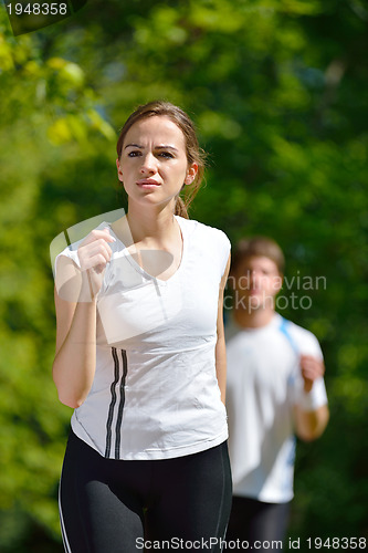 Image of Young couple jogging