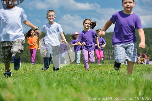 Image of happy kids group  have fun in nature