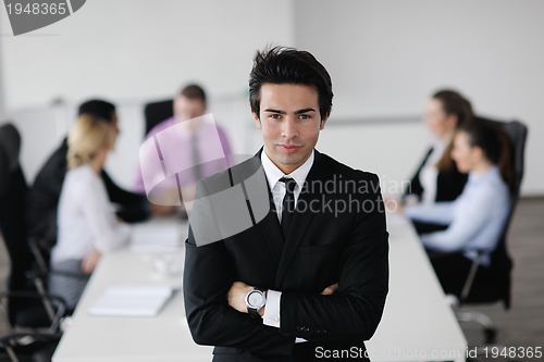 Image of young business man at meeting