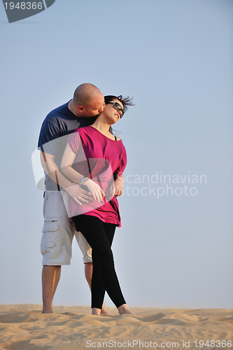 Image of couple enjoying the sunset