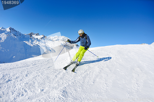 Image of skiing on fresh snow at winter season at beautiful sunny day