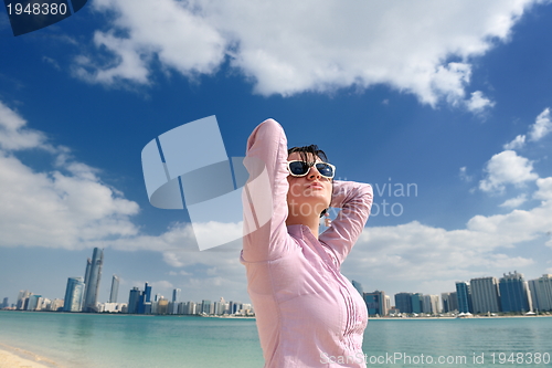 Image of happy tourist woman