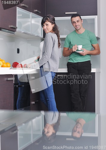 Image of young couple have fun in modern kitchen