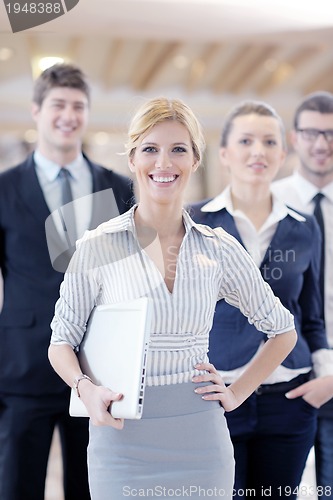 Image of business woman standing with her staff at conference