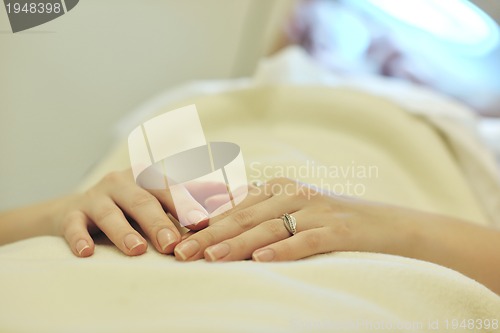 Image of woman with facial mask in cosmetic studio