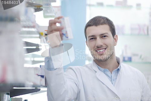 Image of pharmacist chemist man in pharmacy drugstore