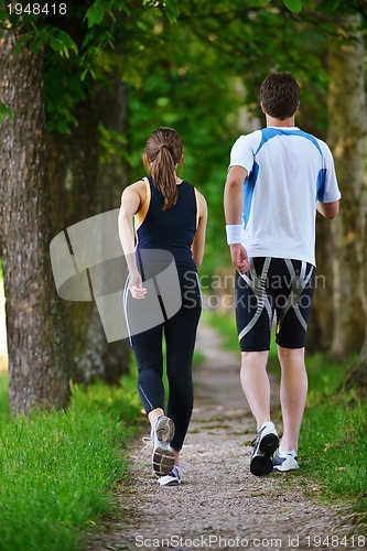 Image of Young couple jogging