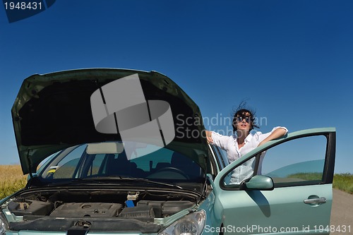 Image of woman with broken car