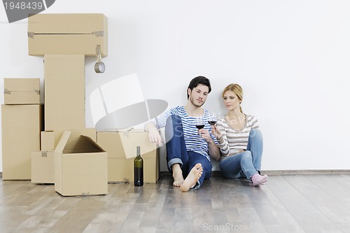 Image of Young couple moving in new home