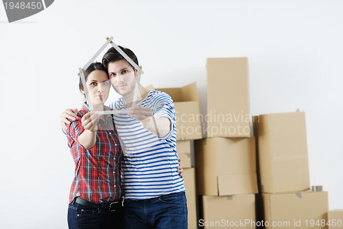 Image of Young couple moving in new house